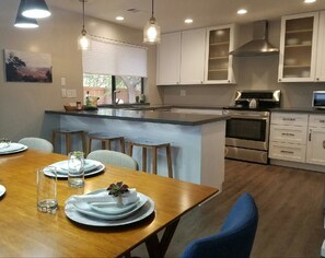 Enjoy meals in the kitchen with a central island and dining area for two.