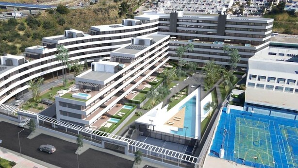 A modern hotel with multiple floors, a rooftop pool, and a sports court. - Stunning Apartment in Estepona, Spain Private Pool (Estepona)