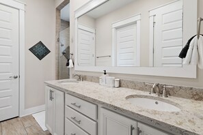 Combined shower/tub, hair dryer, towels, soap