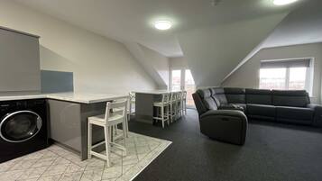 Apartamento superior | Área de estar