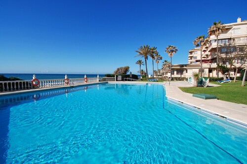 Beachfront Apartment in Lubina del Sol | Pool, Padel, Parking &  Beach Access