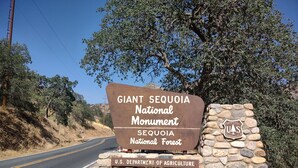 A sign for the Giant Sequoia National Monument, indicating it is managed by the U.S. Department of Agriculture. - Delightful Barn-Tavern Close to GIANT SEQUOIAS (Springville)