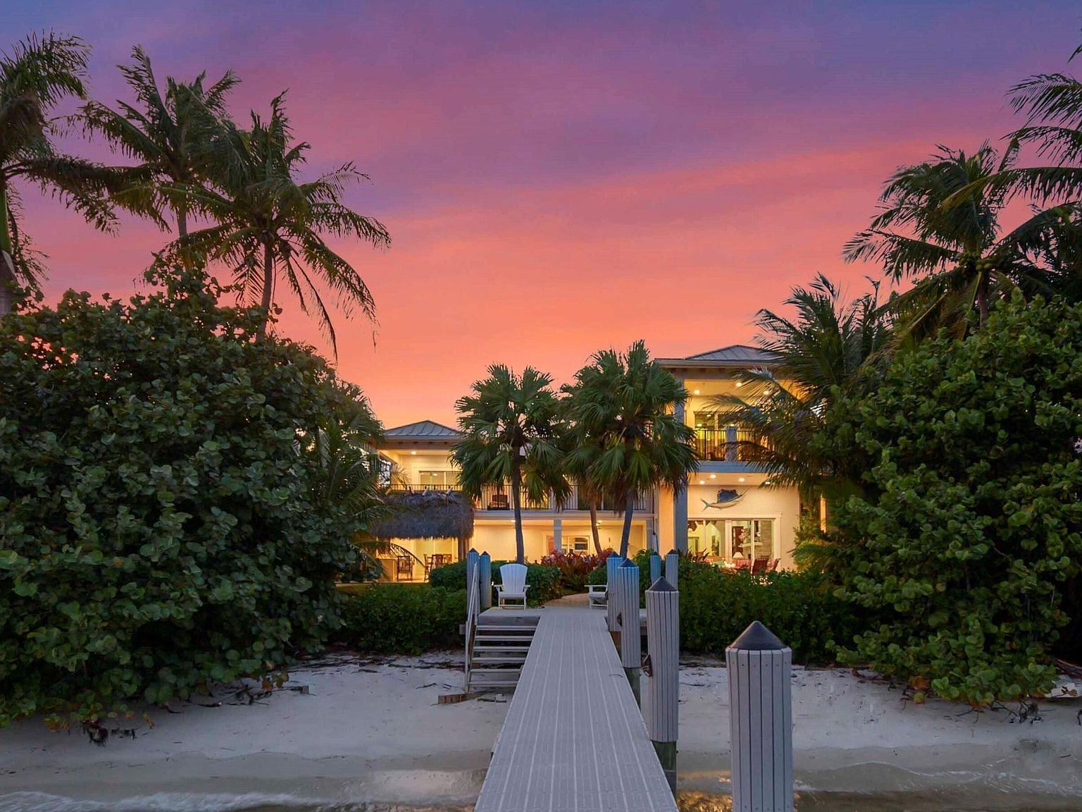 A waterfront oasis with soft white sand beach, pool and intracoastal dock views.