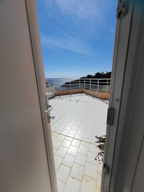 Step out onto the balcony and take in the breathtaking views of the sea.