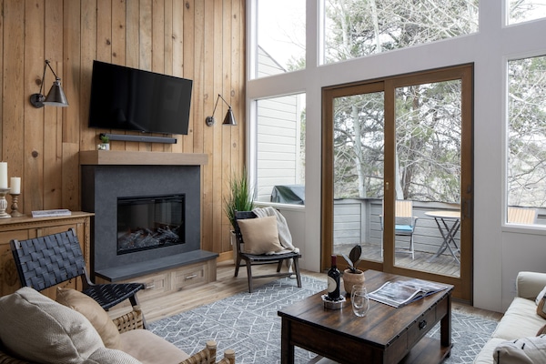 Modern electric fireplace with multiple flame and ambiance settings.