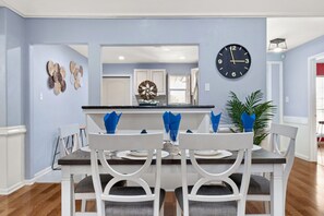 Enjoy meals in this stylish dining area with a dining table and comfortable seating.