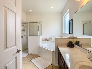 Combined shower/tub, hair dryer, towels, soap