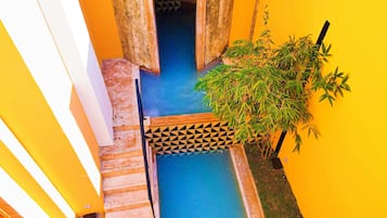 Outdoor pool, open 9:00 AM to 9:00 PM, sun loungers