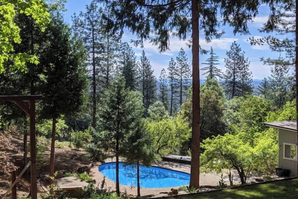 In-ground pool with a view of the Sierra Nevada mountains.
