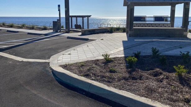 A parking area with a gazebo and a bench overlooking the ocean. - The Snapper House-Carrabelle (Carrabelle)