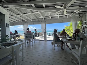 Outdoor dining - Bright and cheerful island bungalow w/ ocean views (New Castle)