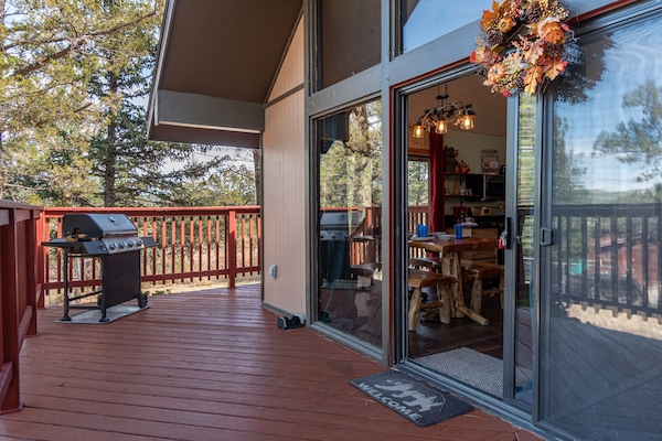 The front deck is open and inviting. Stainless steel gas grill for guests to use