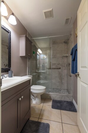 Combined shower/tub, hair dryer, towels, soap