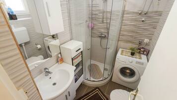 Bathtub, hair dryer, towels