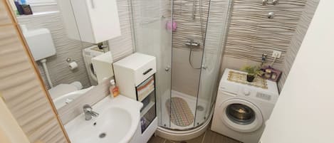 Bathtub, hair dryer, towels