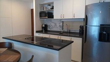 Fridge, microwave, stovetop, coffee/tea maker
