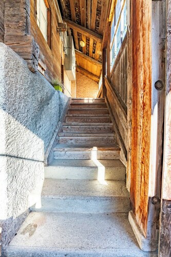 Cozy chalet with wood burning stove surrounded by Swiss Alps