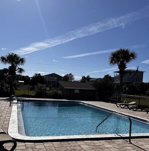 Relax by the pool surrounded by lush palm trees and enjoy a refreshing swim.