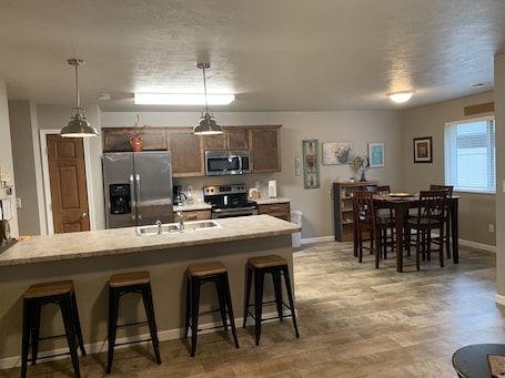 Fridge, microwave, stovetop, dishwasher. Juniper Townhome #3