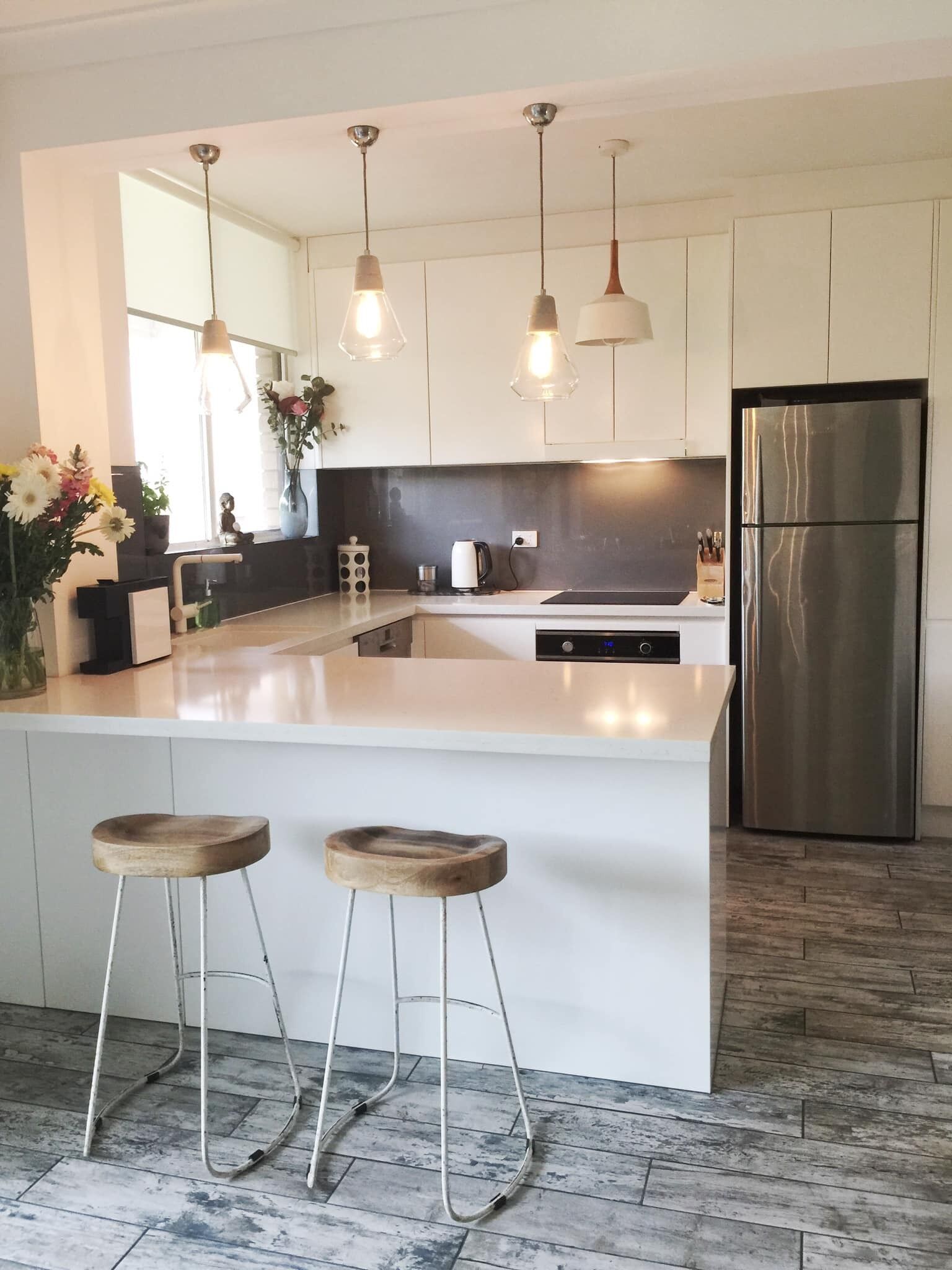 Chic designer garden apartment moments from beach!