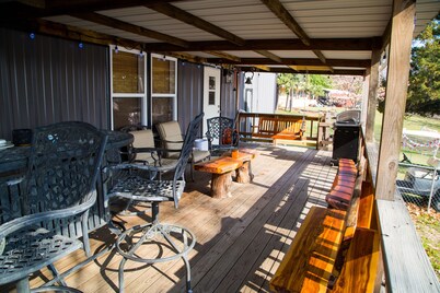 Lake front retreat, covered boat dock, large deck , fenced play area, RV parking