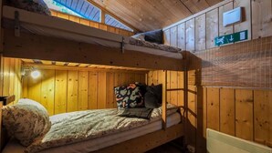 A bunk bed room with a skylight, a thermostat, and a directional sign. - The Secret Cabin with hot tube in nature reserve close to Reykjavik  (Hafnarfjordur)