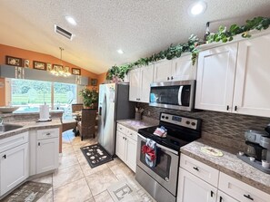 Coffee/tea maker, fridge, microwave, oven