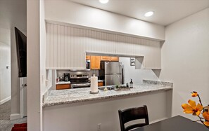 Fridge, stovetop, coffee/tea maker, cookware/dishes/utensils