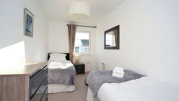 3 bedrooms, premium bedding, laptop workspace, bed sheets