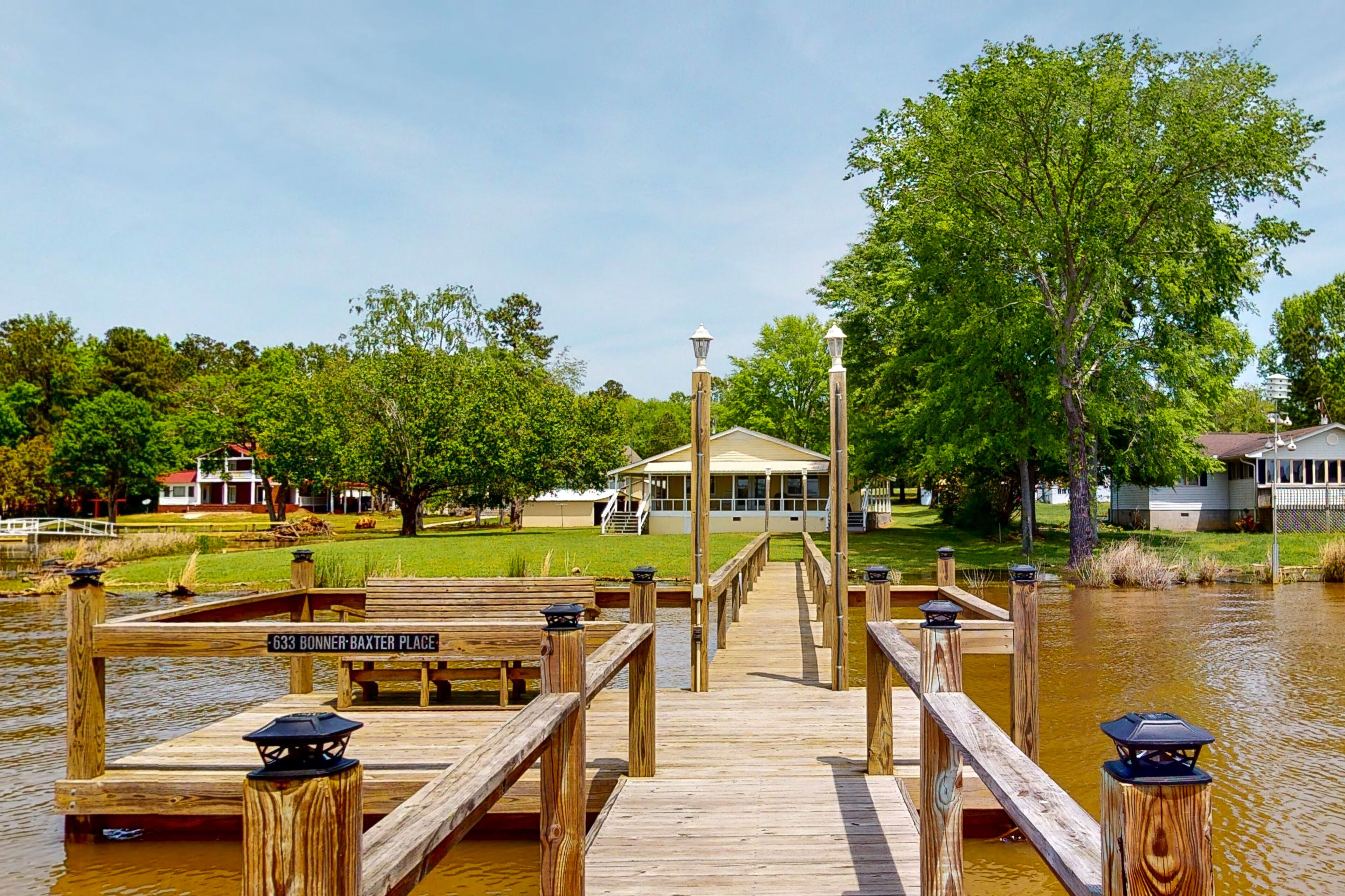 Lakefront home with incredible sunset view, private dock, screened porch, and AC