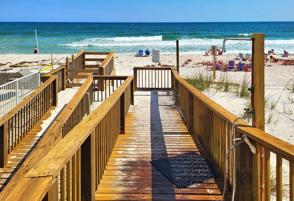 Walk along the boardwalk to the sandy beach, where you can sit on a beach chair or relax in the sun.