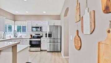 Coffee/tea maker, fridge, microwave, oven