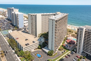 A high-rise hotel with a rooftop pool, parking garage, and beachfront view. - Completely Renovated Condo with Amazing View of the Ocean (Ocean City)