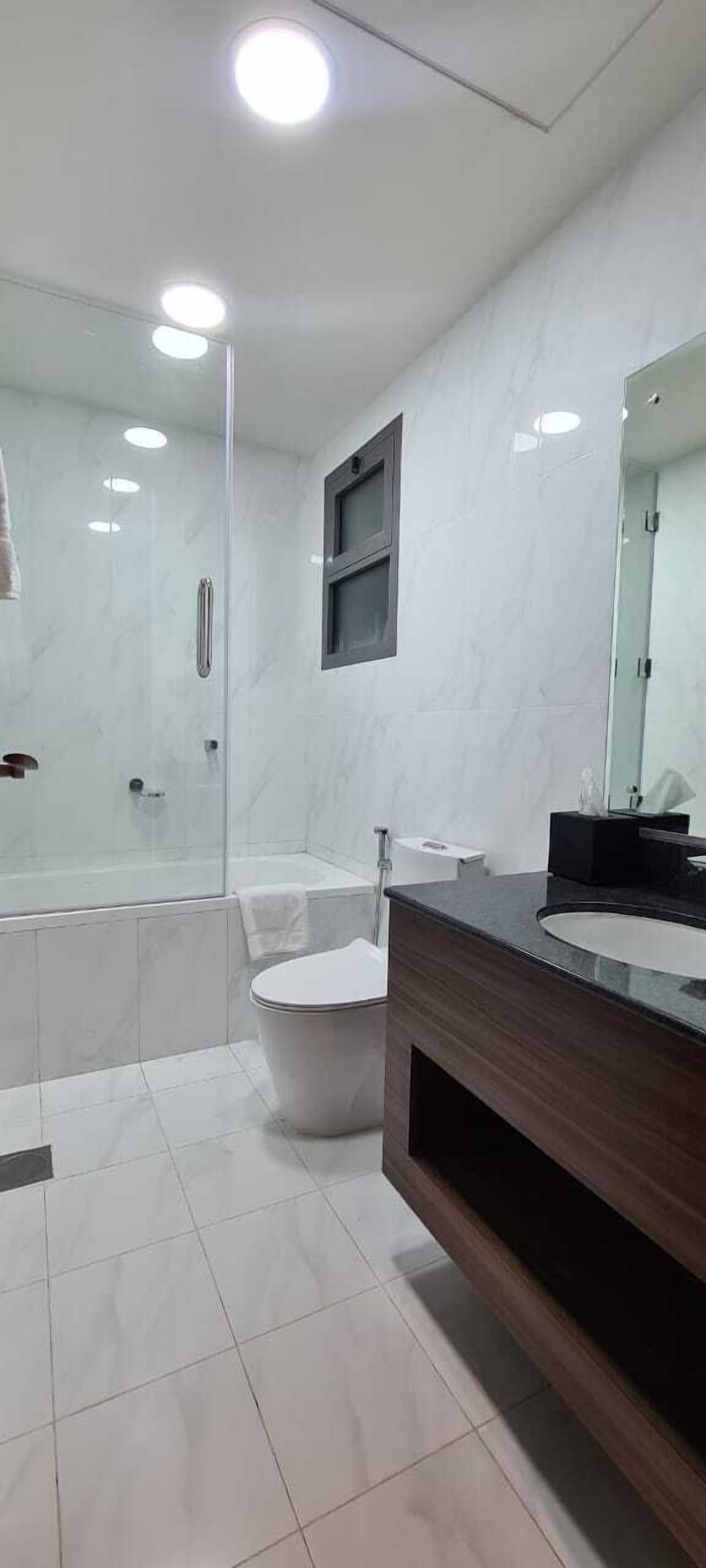 executive suite | bathroom | shower, hair dryer, bathrobes, slippers