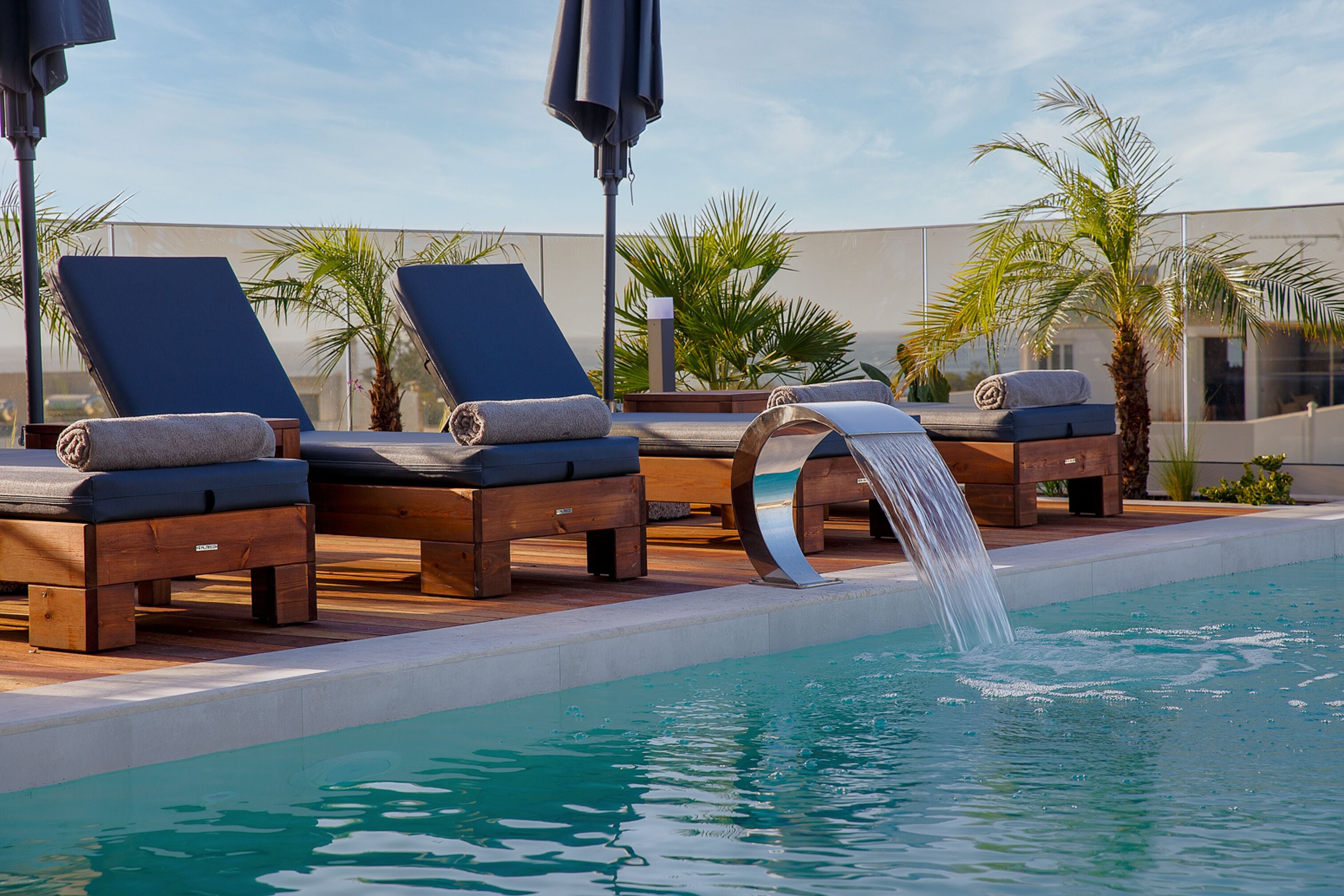 Seasonal outdoor pool, pool umbrellas, pool loungers