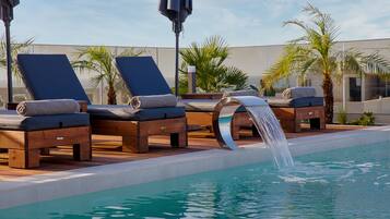 Seasonal outdoor pool, pool umbrellas, pool loungers