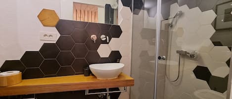 Shower, hair dryer, towels, soap