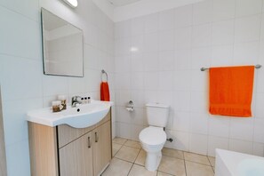 Bathtub, hair dryer, towels