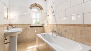 Bathtub, hair dryer, towels