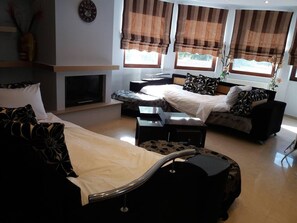 Villa | Living room | 30-inch TV with digital channels, fireplace - Maia Luxury Pool Villa in Afandou Rhodos (Rhodes)