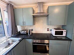 Chalet (2 Bedrooms) | Private kitchen | Microwave, oven, cookware/dishes/utensils - Cosy 2BD Chalet St Ives Holiday Village (St Ives)