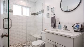 Shower, hair dryer, towels