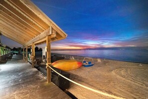 Relax on the beachside deck with a boat at your doorstep.