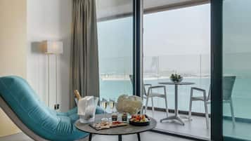 Beach View Corner Suite | Minibar, in-room safe, desk, laptop workspace