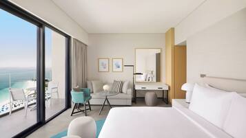 Deluxe Beach and Pool King Room | Minibar, in-room safe, desk, laptop workspace