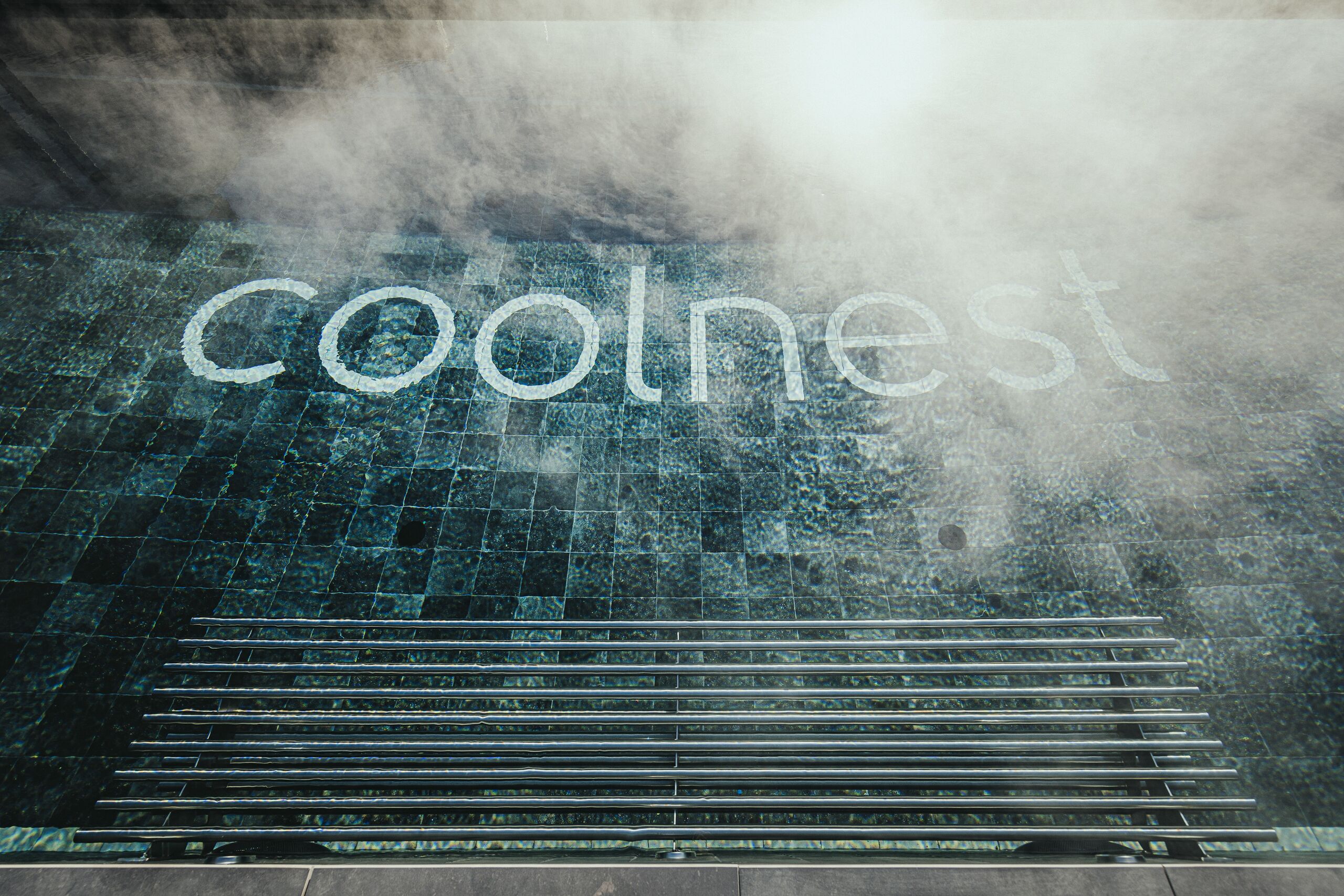A tiled floor with the word "coolnest" written on it.