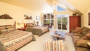 A spacious bedroom with two beds, a large window, and a view of the outdoors. - Blue Mesa Lodge 32A by AvantStay | Located In The Heart Of Mountain Village (Telluride)