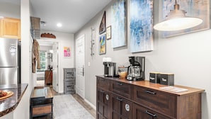 A kitchen with a refrigerator, coffee maker, and cabinets. - Etta Place 6 by AvantStay | Ski In/ Ski Out Unit! (Telluride)