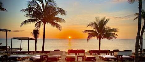 On the beach, white sand, free beach cabanas, sun loungers