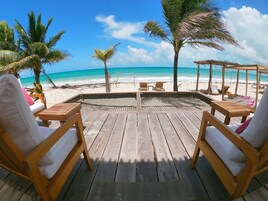 On the beach, white sand, free beach cabanas, sun loungers